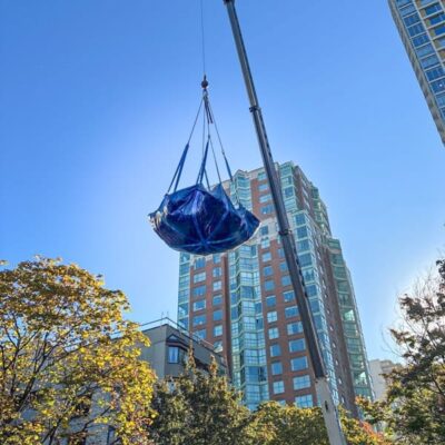 Lifting a load of trash with StrongSling and a crane. Lifting a load of trash with StrongSling and a crane.