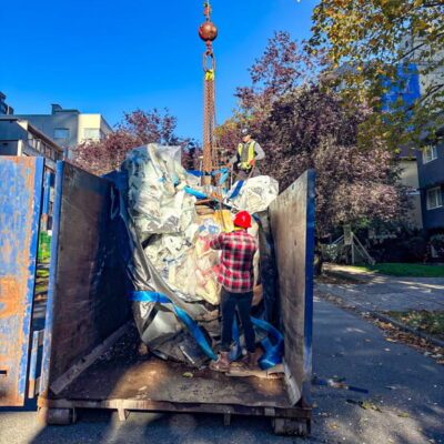 Dumping trash into a container with a StrongSling. Dumping trash into a container with a StrongSling.